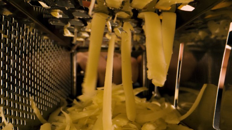 Close up of cheese being grated