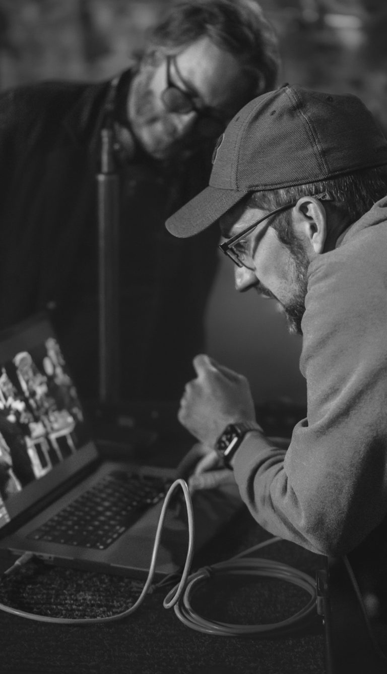Photographer checking photos live on his laptop
