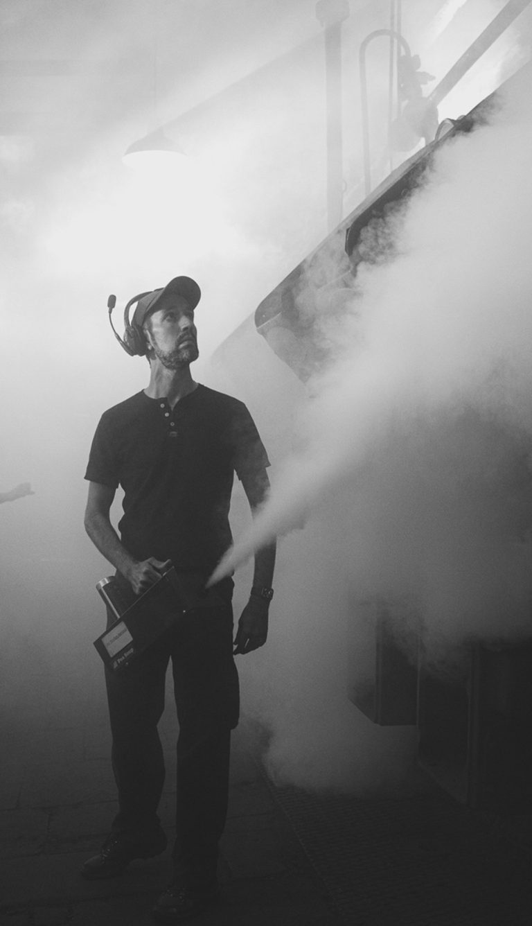 Director of Photography adding smoke to the scene